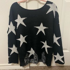 Star print distressed sweater